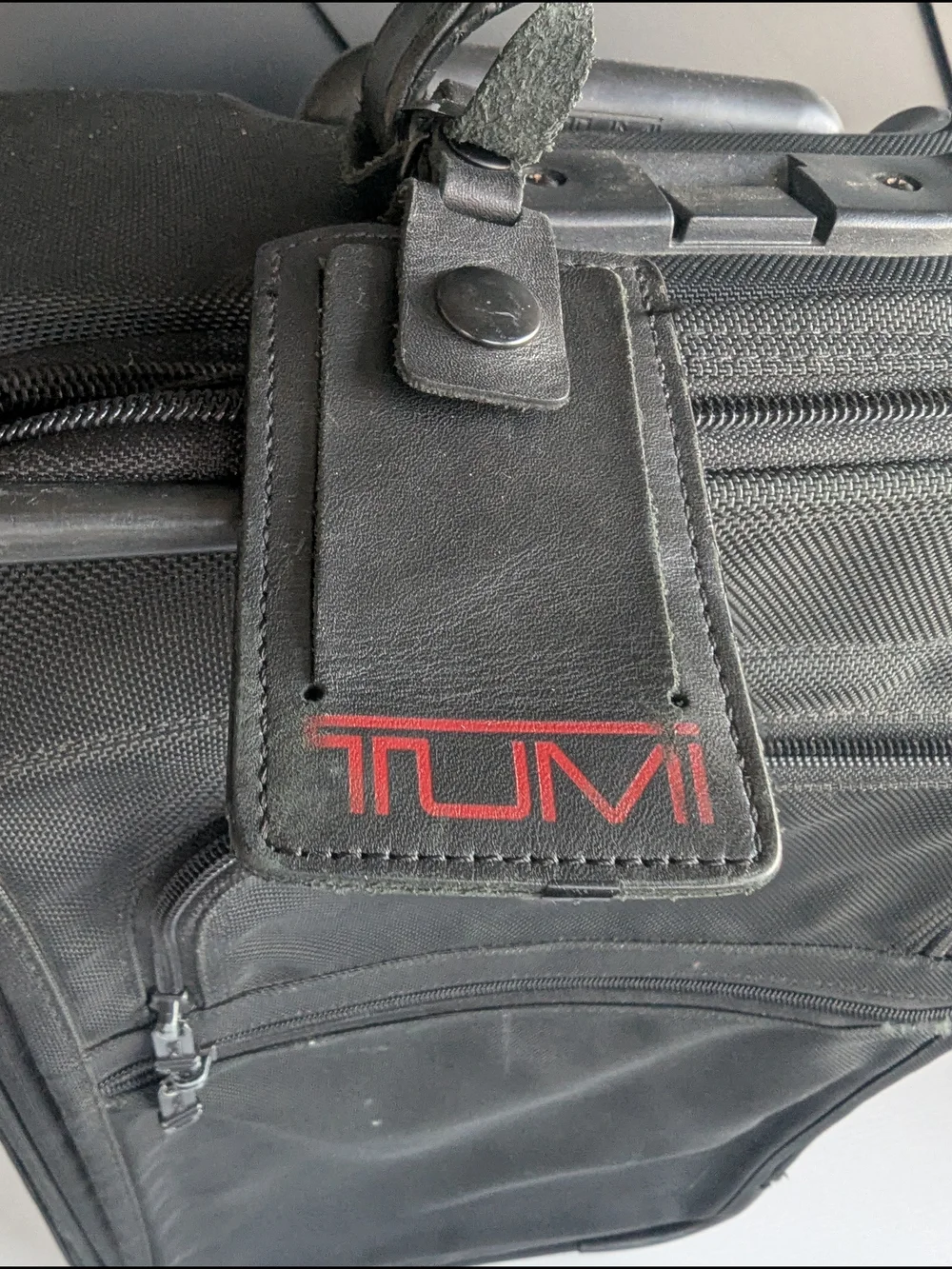 Tumi Black Men’s Carry-On Rolling Travel Bag